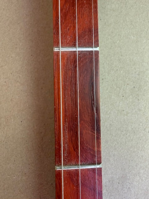 D Grand, scratch on fingerboard
