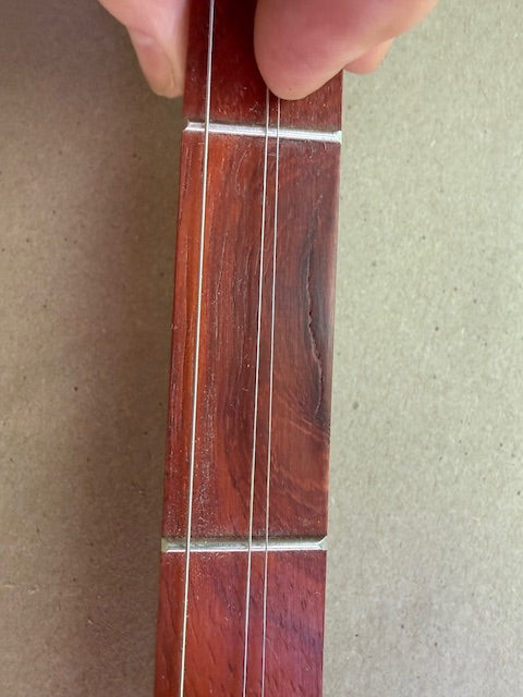D Grand, scratch on fingerboard